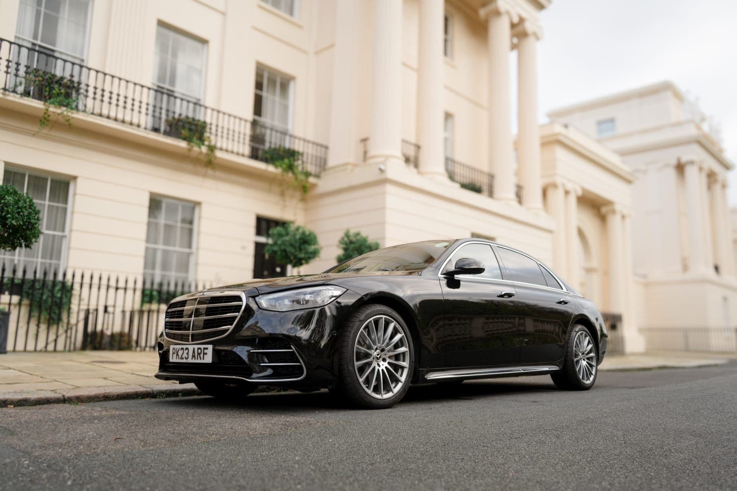 Black Mercedes S-Class parked on a London terrace street