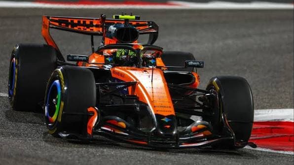 A Formula 1 car at speed on a Grand Prix circuit