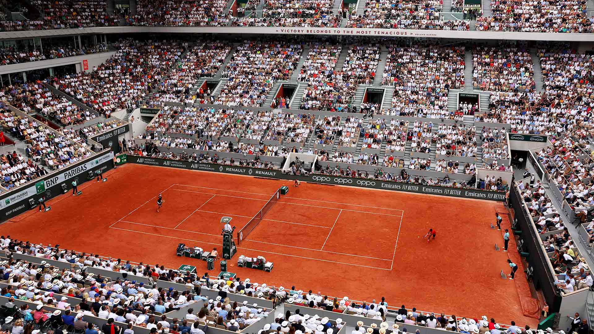 Court Philippe-Chatrier at Roland Garros, viewed from the stands during a match on the red clay