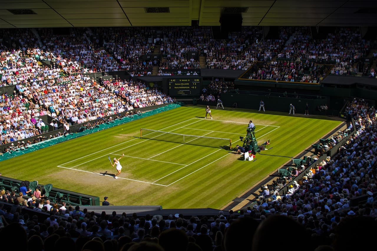 Centre Court at Wimbledon, viewed from the stands during a match on the grass